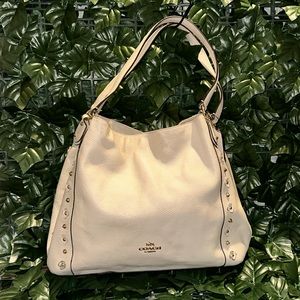 Beautiful sophisticated off white Coach double zipper well kept.